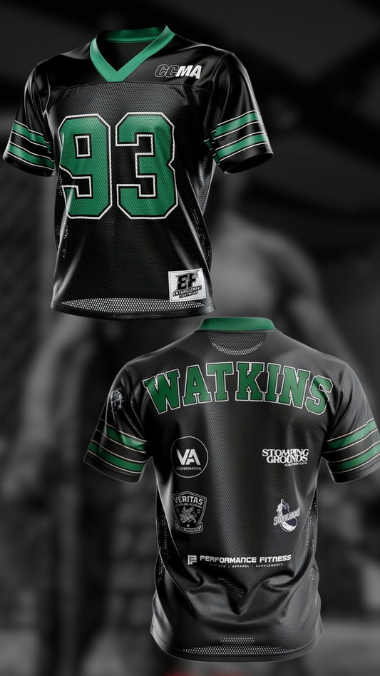 Black sports jersey with green accents and visible branding on a dark background